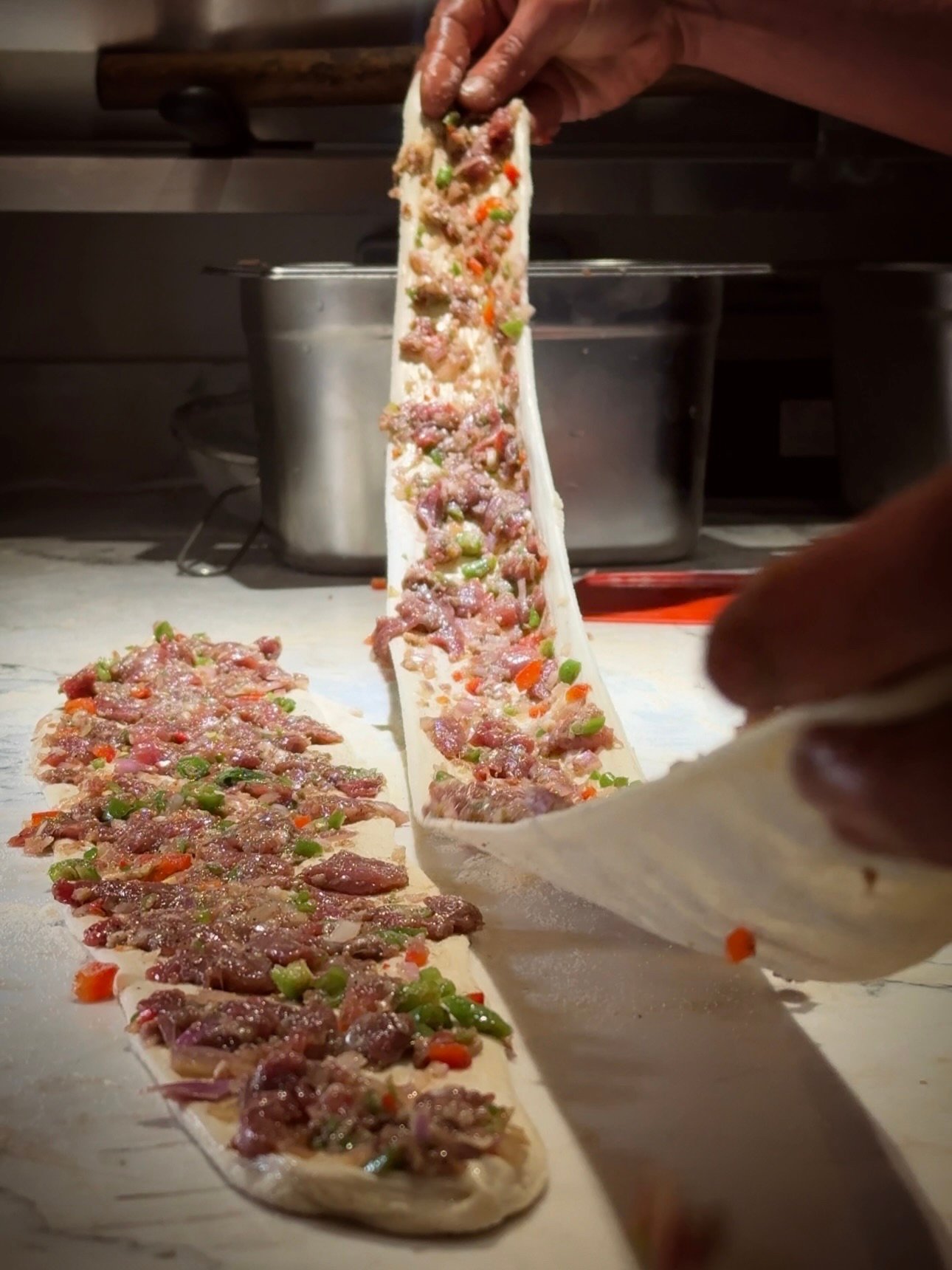 Long pide prepared by hand